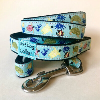 Dog leash with sea-themed design of sea turtles and fish. Durable construction and materials with a seize proof stainless clip