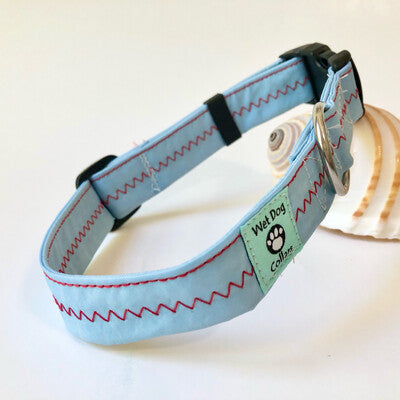 Nautical sail collar with red stitching on a blue sailcloth wet dog collars