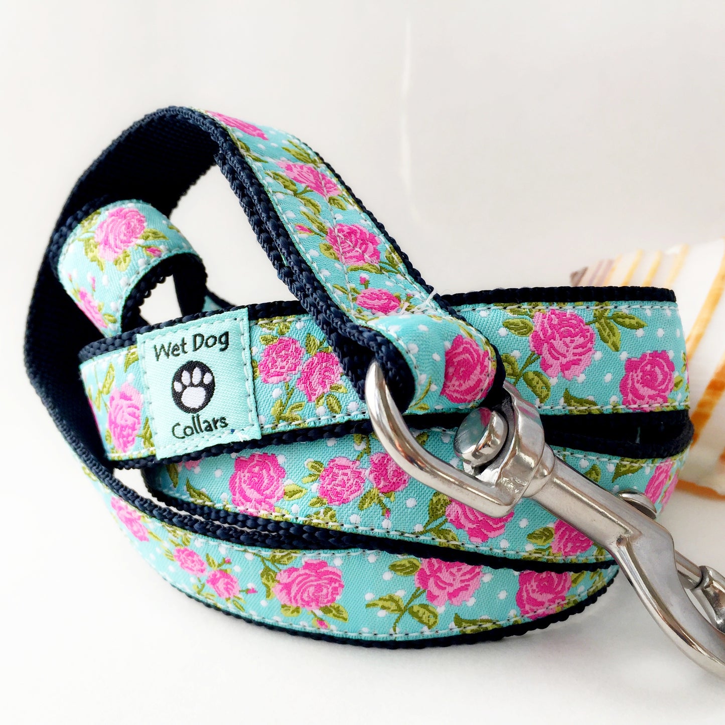 Beach dog leash with pink cabbage roses on aqua background.  Made with a rust proof stainless steel leash clip