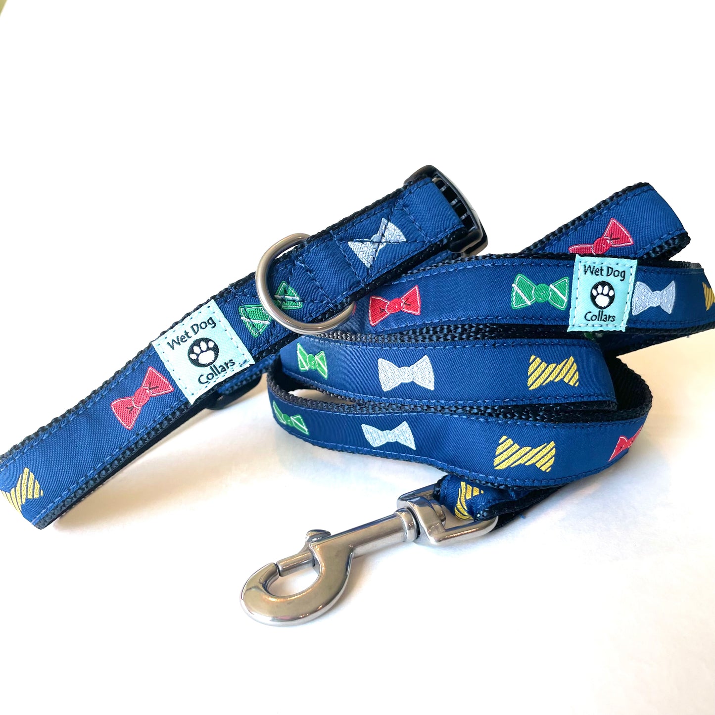 Navy blue dog collar and leash with colorful bowties made for saltwater with stainless hardware